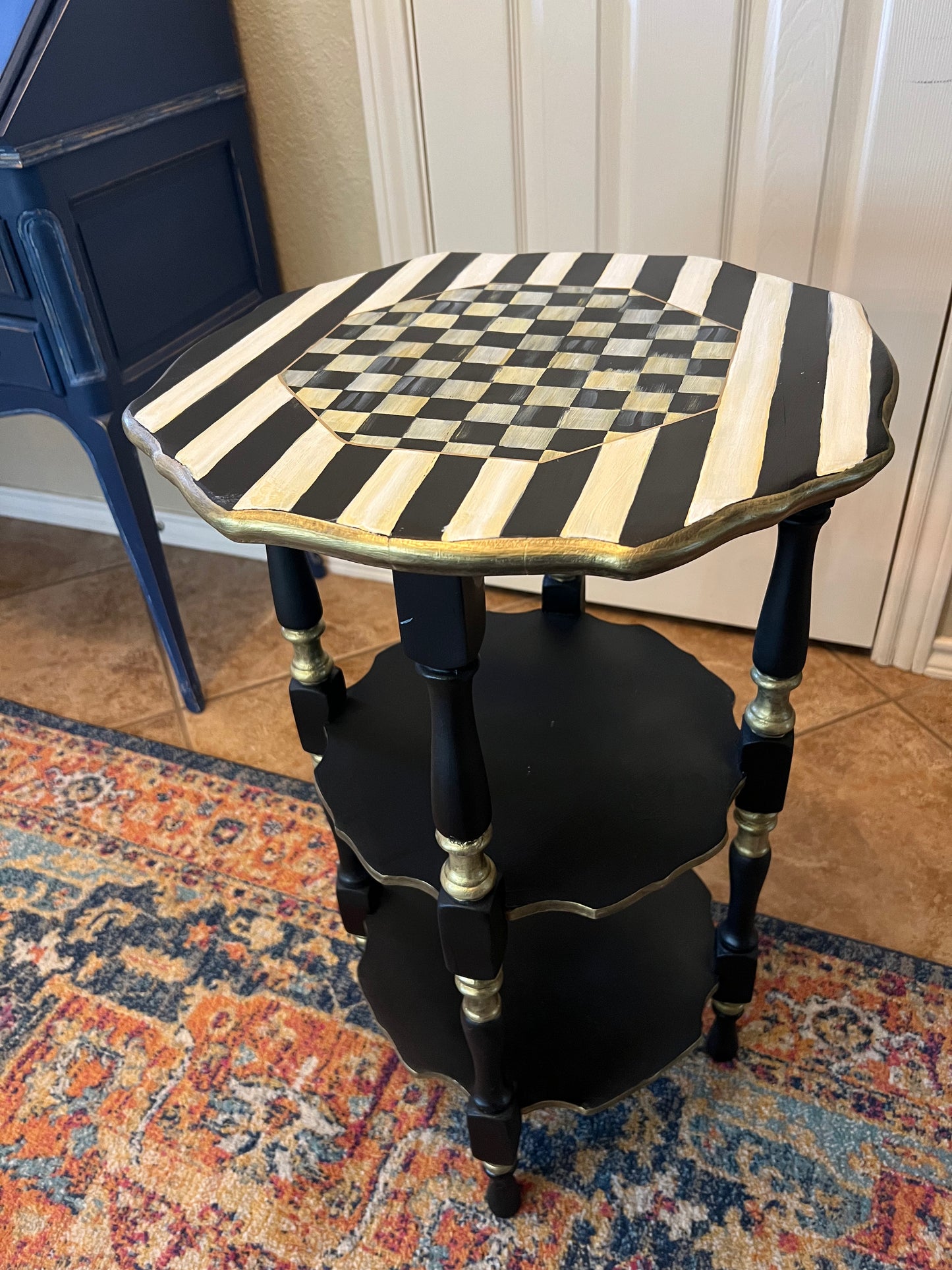 Three tiered antique accent table