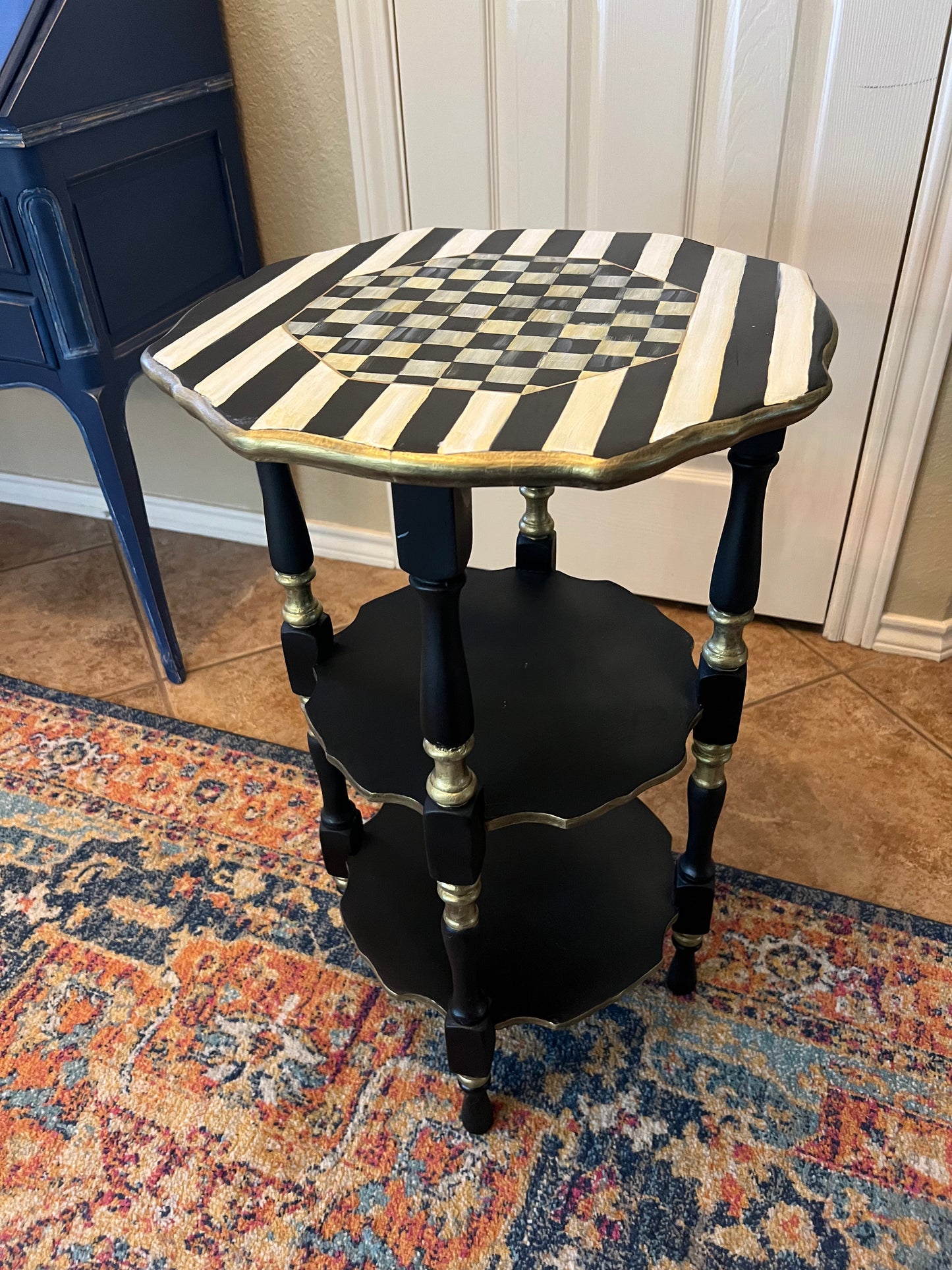 Three tiered antique accent table