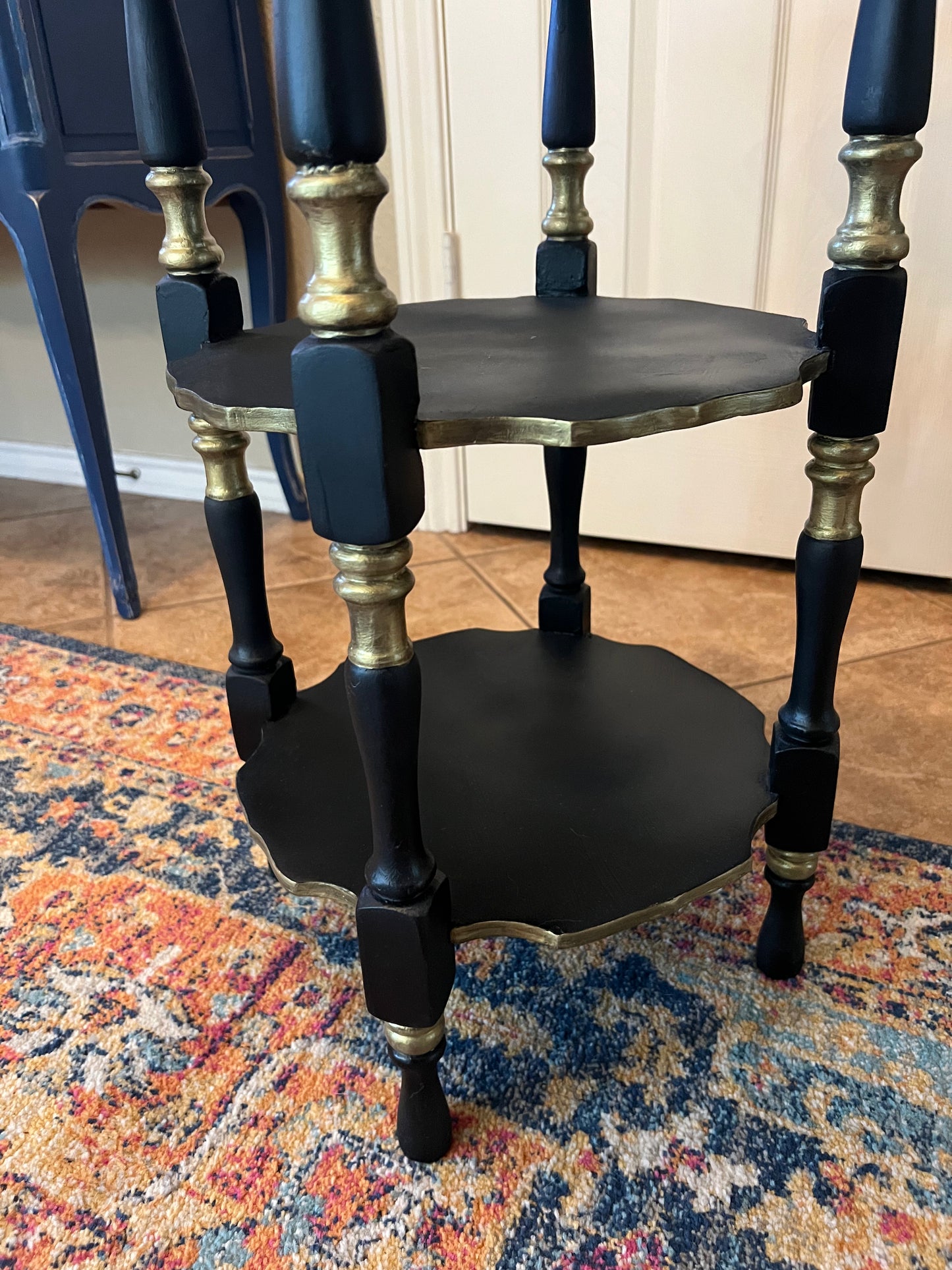 Three tiered antique accent table
