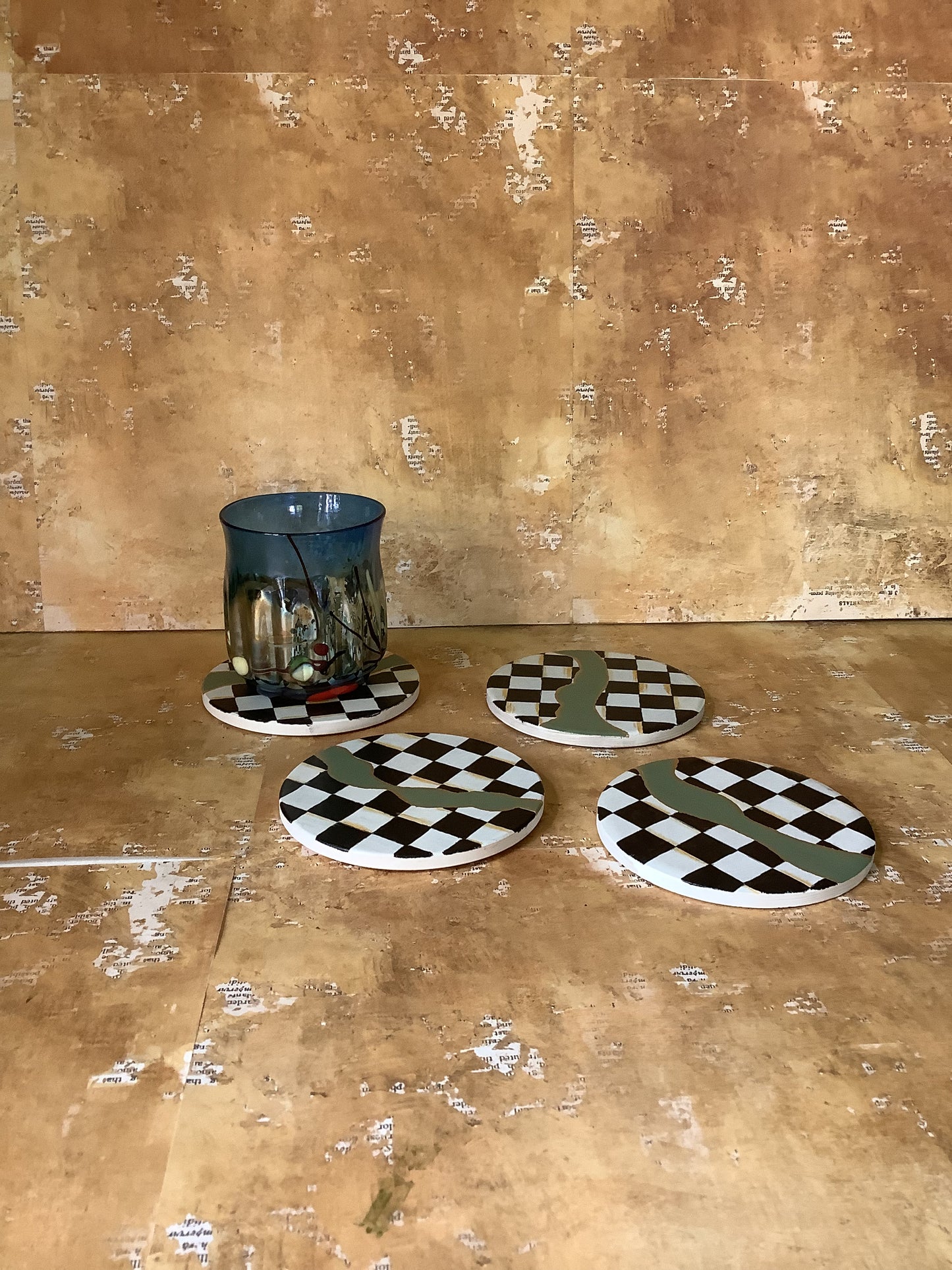 Checkered coasters with green and gold accents