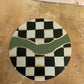 Checkered coasters with green and gold accents